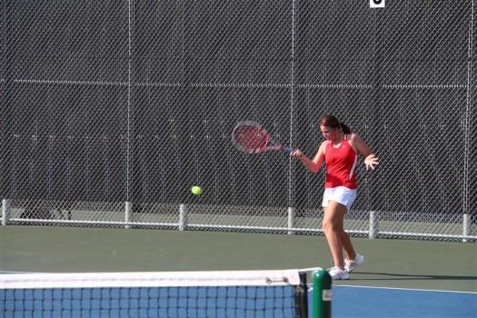 Molly Fisher, junior, hits a forehand shot and wins against the Flower Mound Jaguars. 