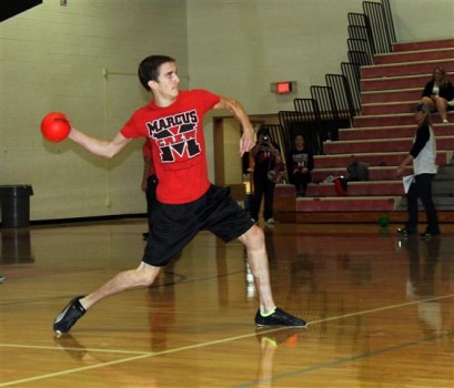 Senior Trevor Foust flings a dodgeball with all of his might. 