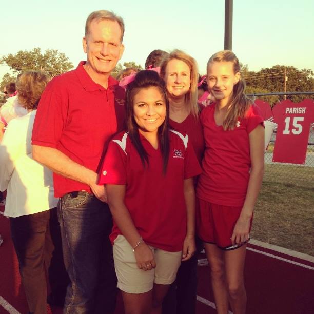 Elizabeth Pool (front, middle) with her adopted father, Ken Pool (left), her mother, Sarah Pool (back, middle), and her sister, Cara Pool (right) at a football game. The Pools adopted Elizabeth two years ago from Casa Hogar in Mexico.