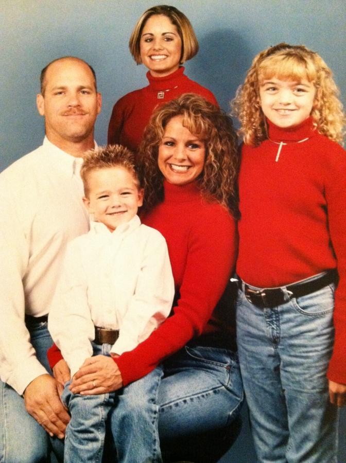 The Corkran family take a family portrait. From left to right, father Tery, sister Amanda Miguez Miller, mother Scherrie and sister Kimberly.