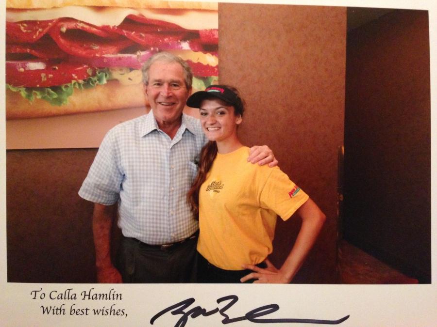 Junior Calla Hamlin meets President Bust at Penn Station in Southlake. Hamlin has also met him at the store's Flower Mound location, her place of work.