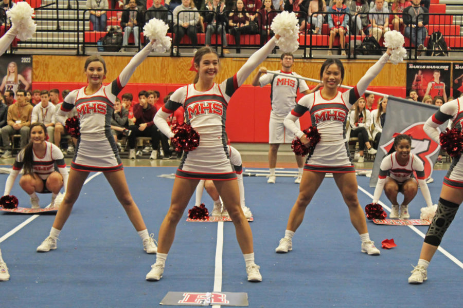 Sophomore Erin Bookout, junior Celine Toias and senior Ivana Tieu perform the second place routine at a pep rally. The cheerleaders don’t perform full routines at events like football games, so the pep rally was an opportunity for the team to show off their hard work to other students.