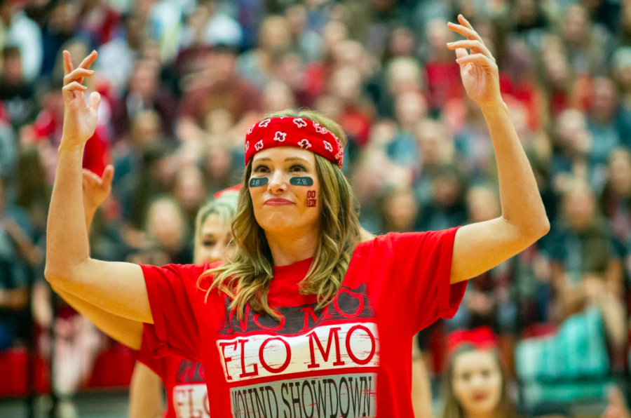 The parents of cheerleaders and football players performed a routine at the pep rally. 