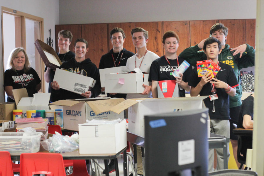 Student+advisory+board+members+junior+Ryan+Steen+and+seniors+Alec+McKisic%2C+Ethan+Lowry%2C+Corbin+Duncan%2C+Patrick+Black%2C+Joseph+Addicott+and+Steven+Sanfelippo+helped+organize+school+supplies+before+they+were+donated+to+Dallas+ISD.