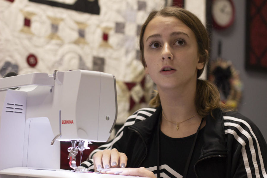 Sophomore Katherine Yezer listens to Fashion Design teacher Kim Watson as she instructs the class. The program providing stockings to families was created by CCA a year ago.