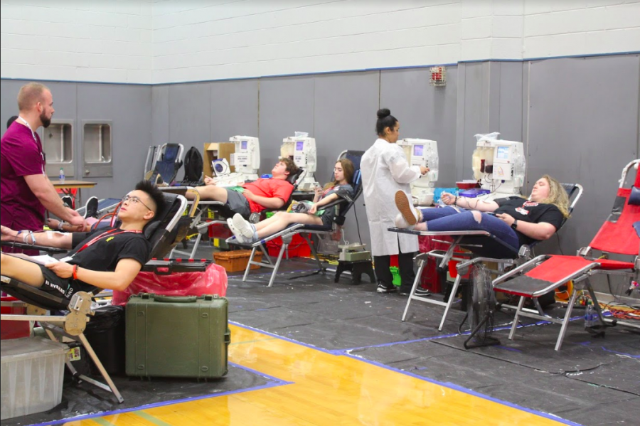 Students lay down as they donate blood. Each donor gave about a pint of blood, which can save up to three lives.