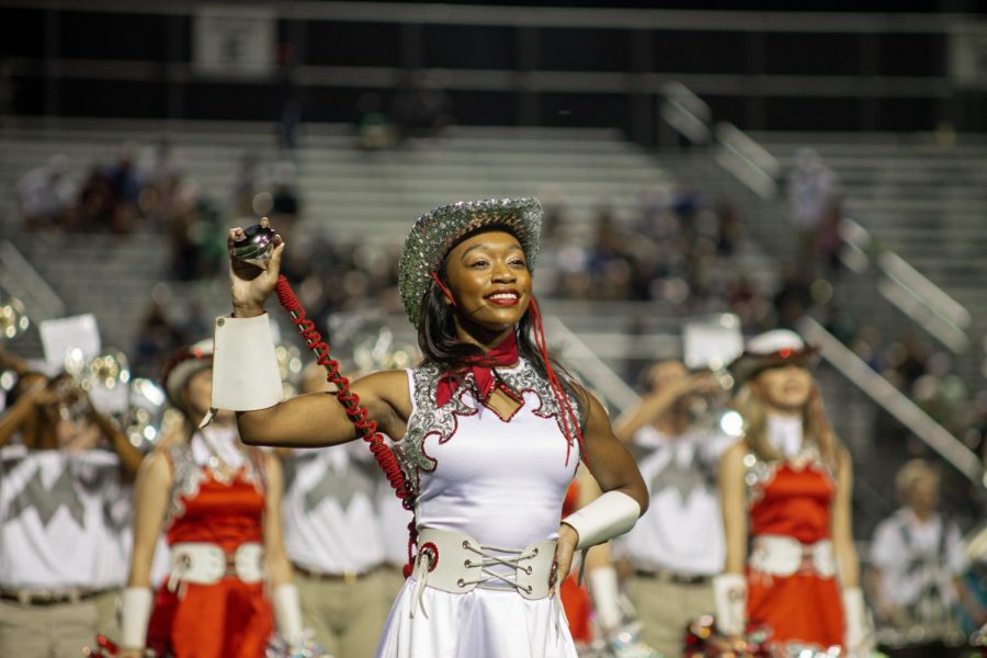 Senior Marquette officer Mariah Wheeler performs in front of the crowd during the Sept. 13 football game. 