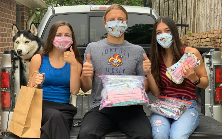Junior Maddie Felan (left) recently started the non-
profit organization All in for Children with her brother, Nick Felan (center), and his girlfriend, Elizabeth Garcia Creighton (right). The group sews masks for children in hospitals.