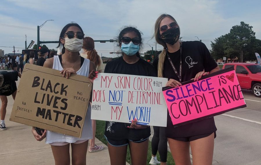 Flower+Mound+High+School+graduates+Meena+Dara+%28left%29%2C+Sarah+Joseph+%28middle%29+and+Julia+Young+%28right%29+join+the+protest+near+the+Flower+Mound+Kroger.