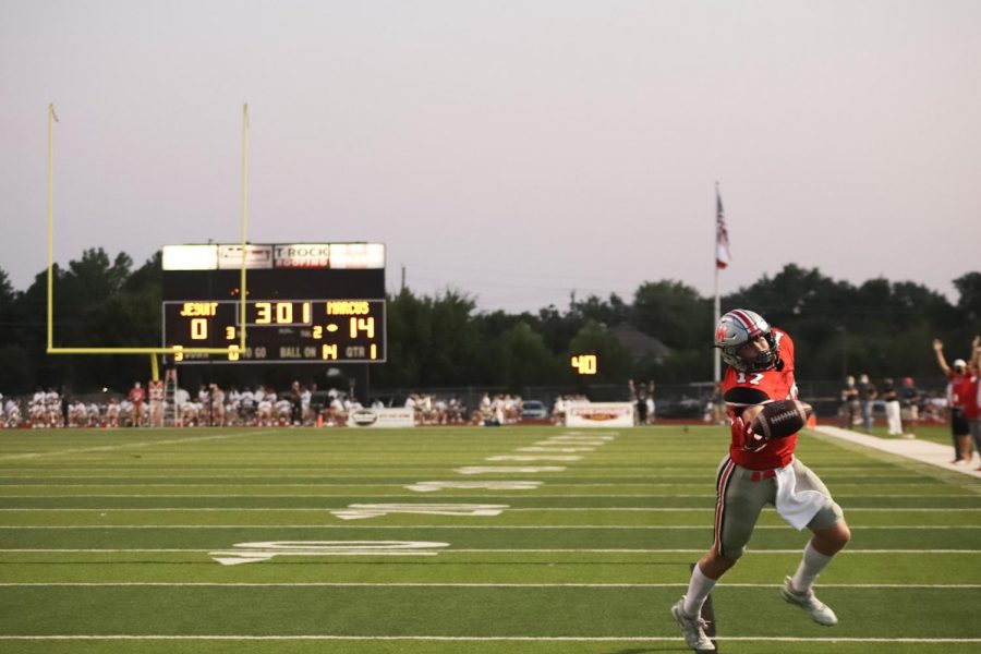 Junior+Connor+Vaughn+reaches+to+catch+the+ball.