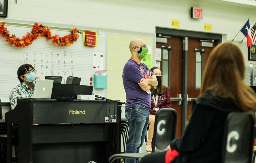 Assistant Choir Director Drew Howard teaches a lesson to the choir students.