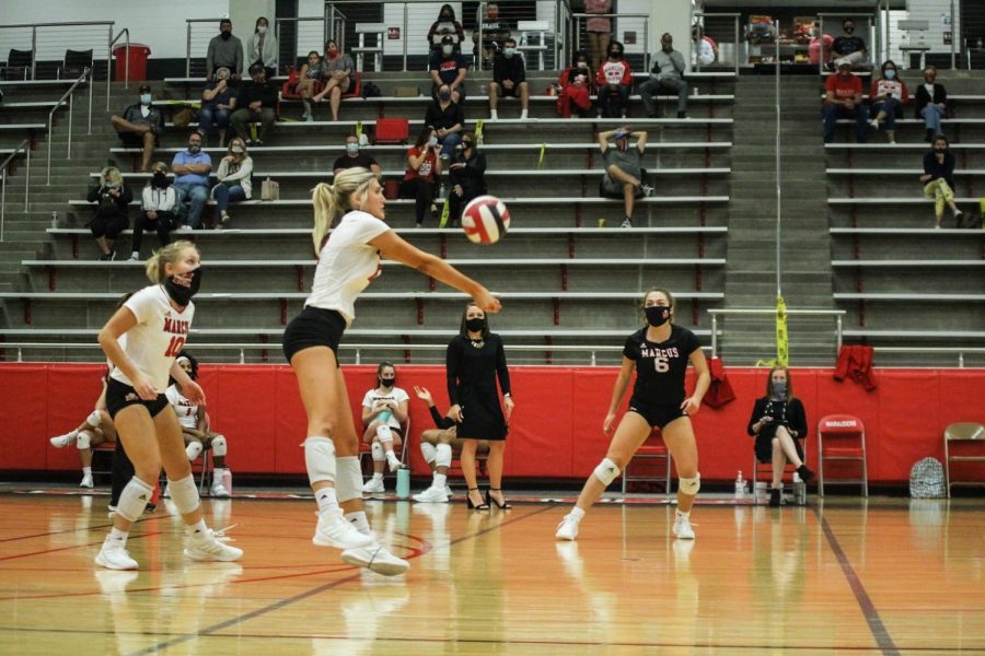 Senior Abby Ekeler sends the ball back over to the Lewisville Farmers. The Marauders won the home conference match 3-0.