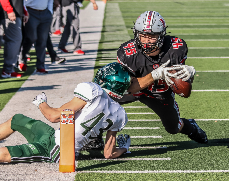 Senior linebacker Tyler Gainey gets tackled on his way down to score the final points of the game.