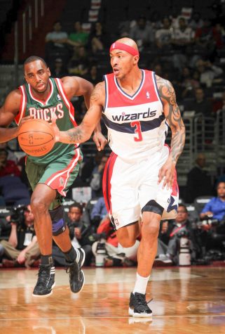 Assistant Basketball Coach James Singleton plays against the Bucks during his NBA career before starting his new job on campus. 