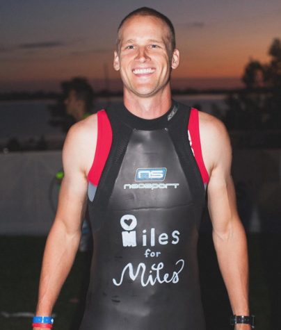 Athletic trainer Cade Ogilvie kept reminders of his son, such as the phrase Miles for Miles on his wetsuit, with him throughout the Ironman.