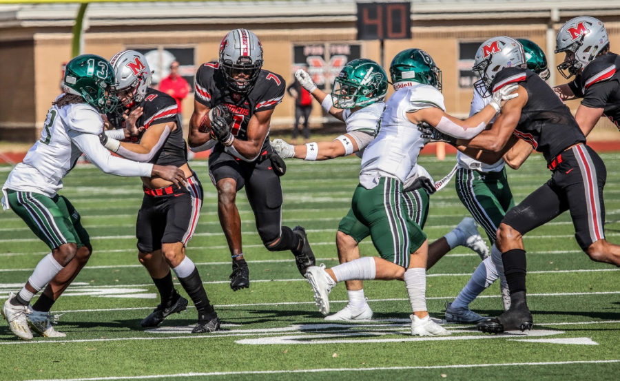 Senior wide receiver J. Michael Sturdivant runs past Prosper players after catching the football.