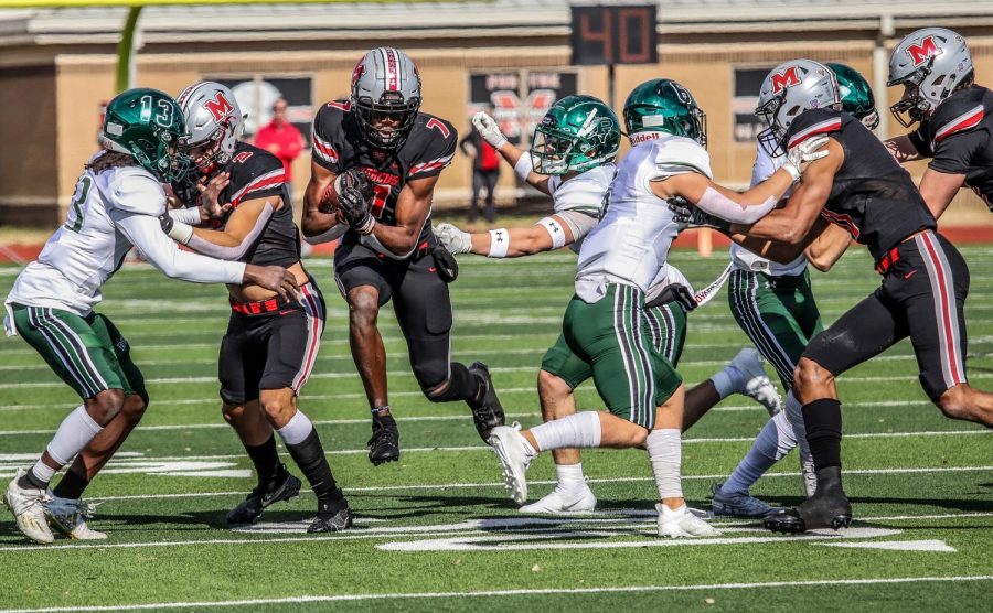 Senior wide receiver J. Micheal Sturdivant runs past Prosper players after catching the football. 