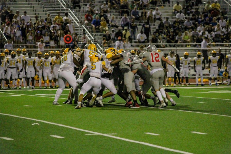 Players from Marcus and McKinney clash in the the third quarter of the game on Sept. 3.
