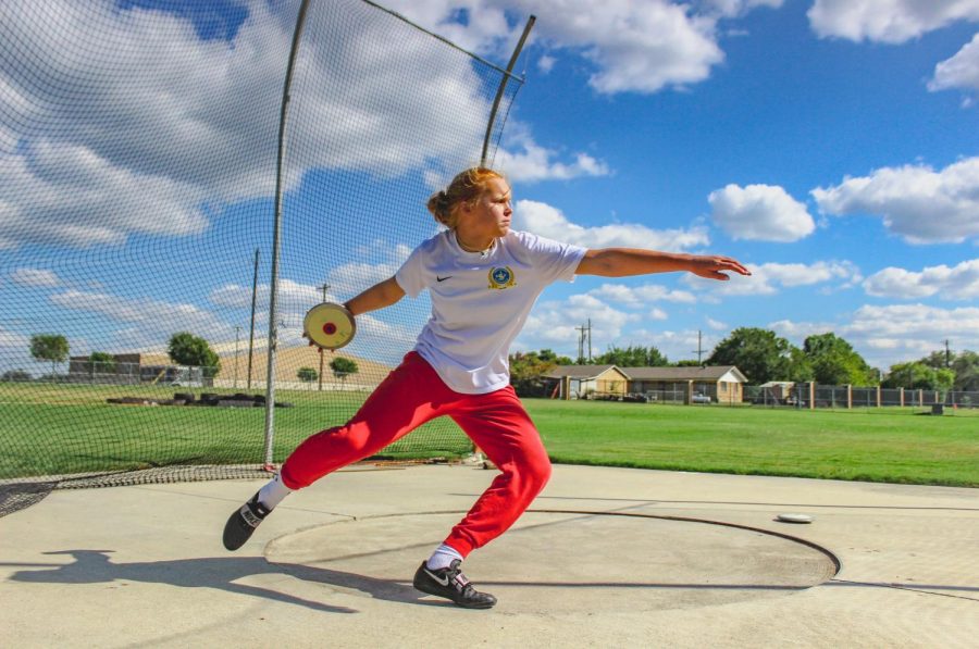 Junior+Emma+Sralla+prepares+to+throw+the+discus.+She+has+competed+in+track+events+since+she+was+9.