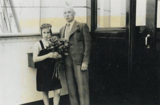 Liesl and her father posing on the St. Louis, Liesl clutching her flowers. They were her “first flowers from a gentleman.” 
