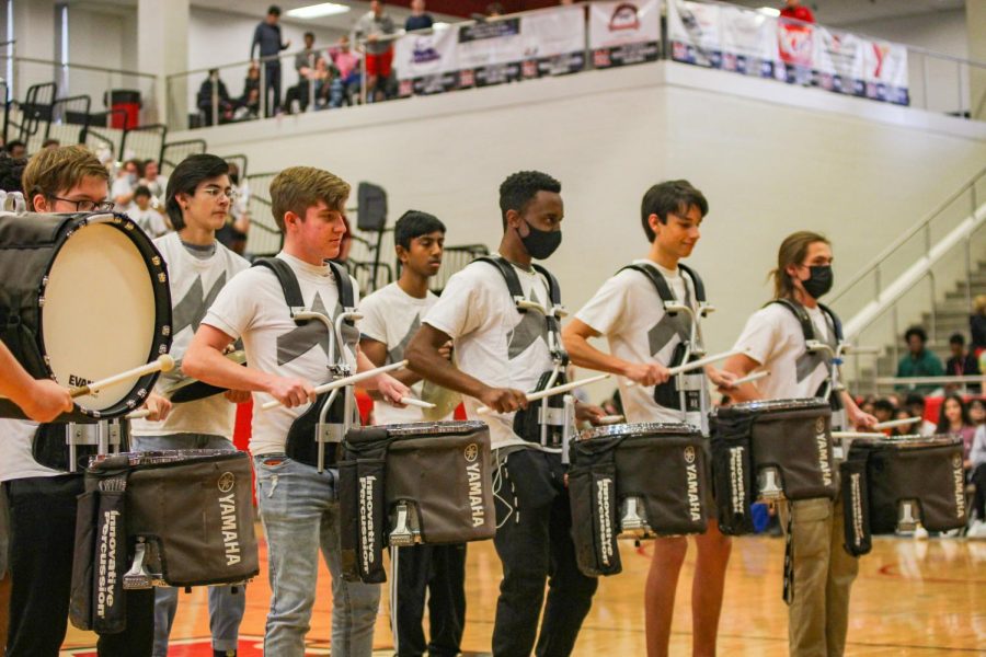 The drumline performs during the pep rally.