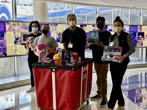 MEDS club officer Seher Hasan and sophomore Harsh Singh took the toys raised in the drive to the Dallas Childrens Medical Center on March 15.
