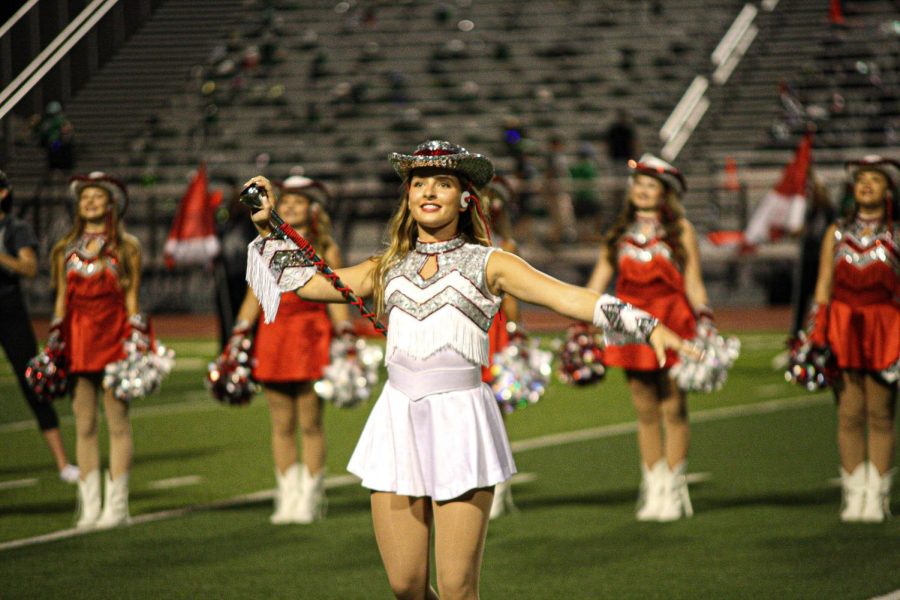 Senior Avery Walters cheers during the Marquette halftime  show.