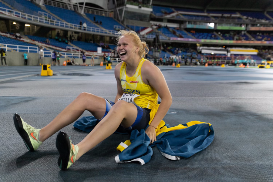 Senior Emma Sralla celebrates with the Swedish flag after placing first in U20 discus World Athletics Championships on Aug. 3. 