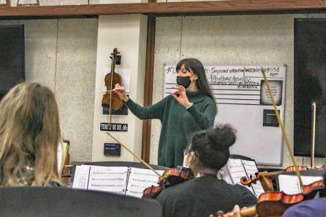 Orchestra Director Allison Washler conducts the Chamber orchestra. Because of student absences, she initially struggled to keep the entire class caught up.