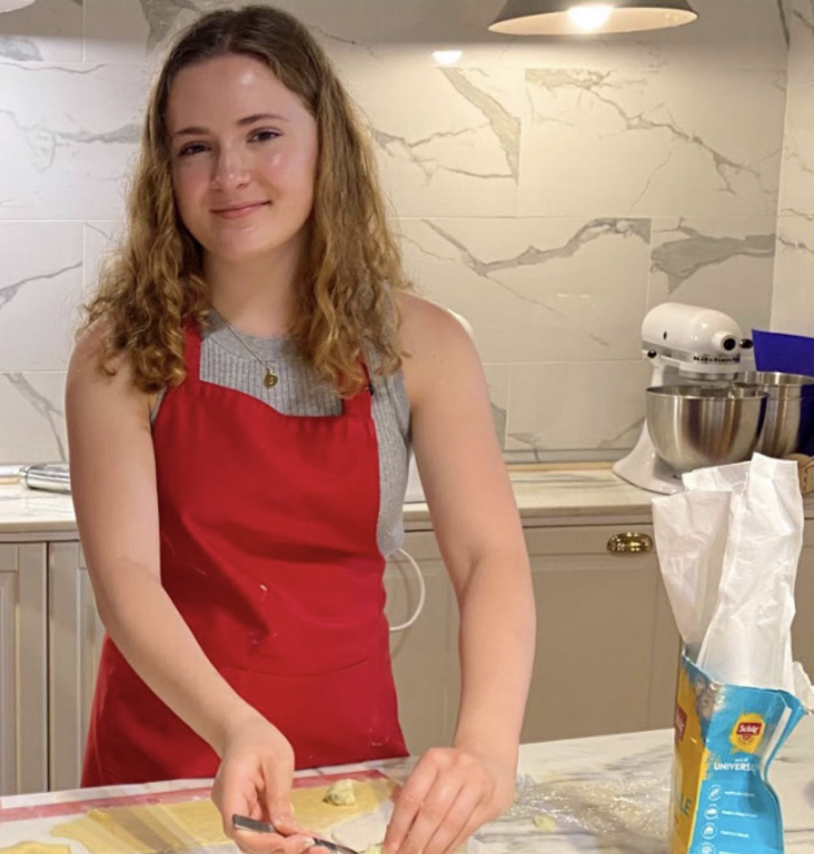 Junior Jacque Stevenson cooks in a gluten free cooking class in Italy