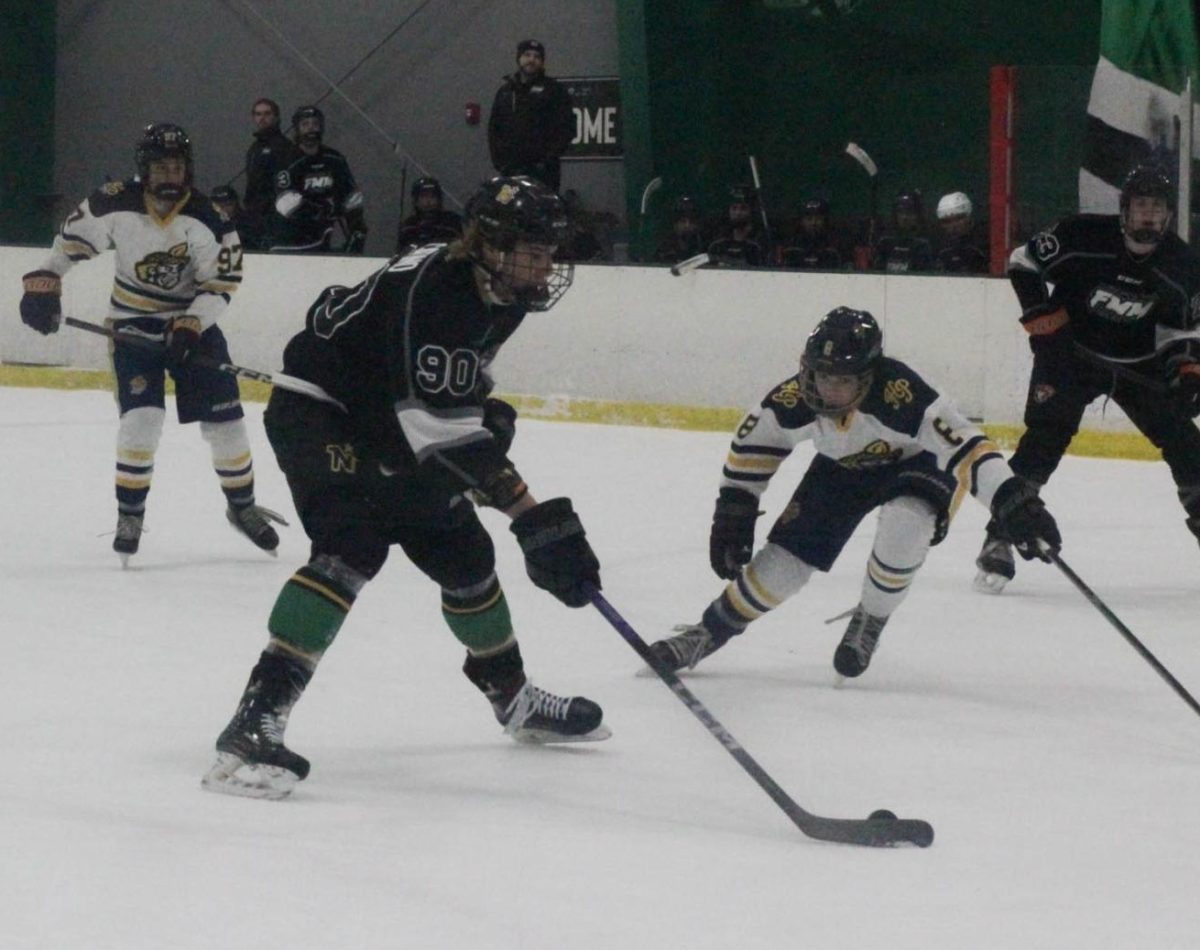 Riley Garrison lunges for the puck to secure a lead in their competition on Jan 17.
