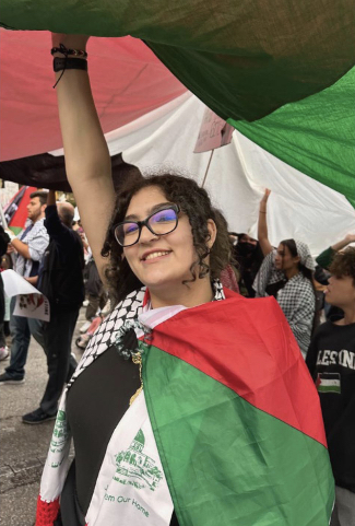 Hiba carries a Palestinian flag as she protests in Austin on Nov. 12. Her family is originally from Haifa, a city that ceased to exist after the creation of Israel.