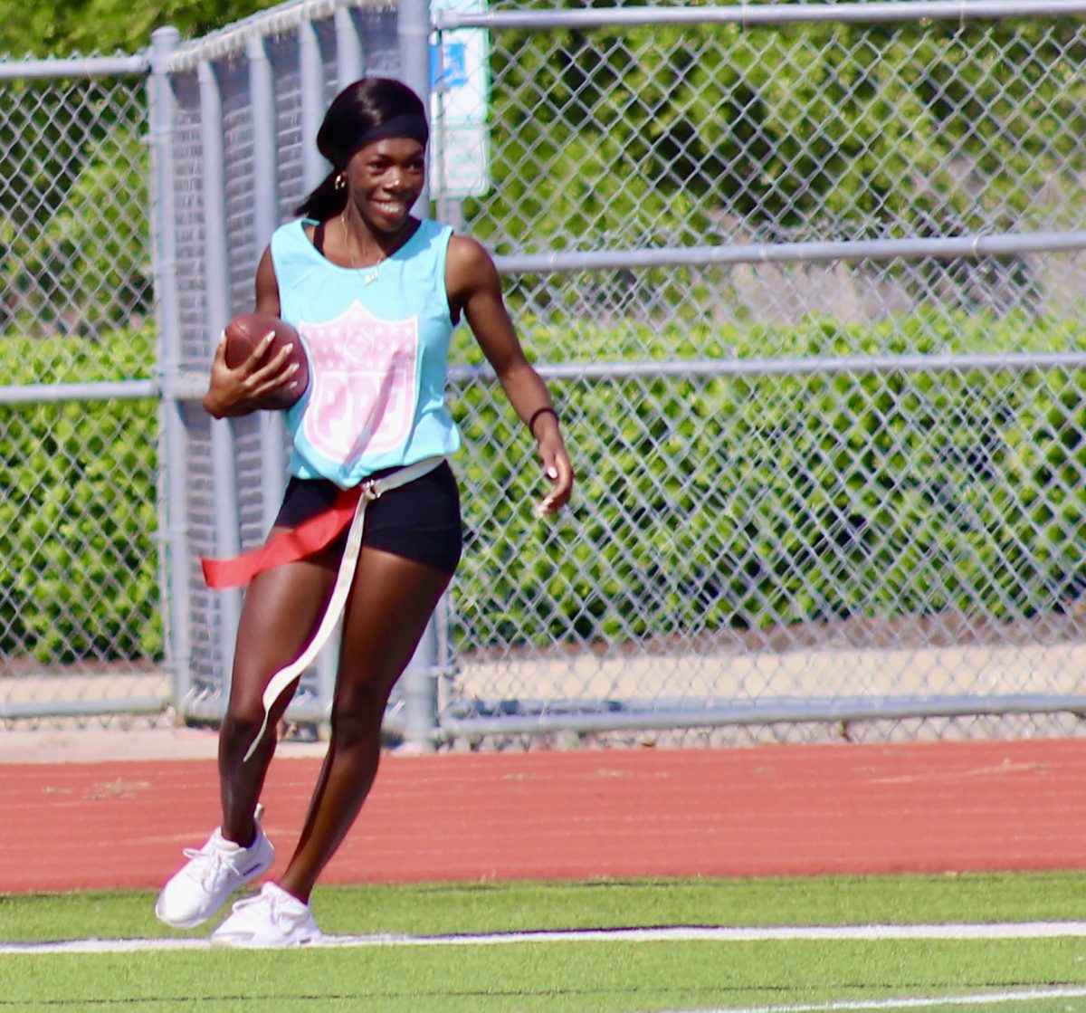 Mercy Fasanya, 12, celebrates in the endzone during the Senior's victory in the annual Powder Puff football game on April 17, 2025.
