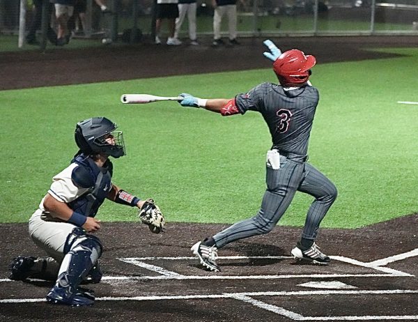 Junior Jameson Mayfield connects with a pitch against Flower Mound in district play on April 10, 2026.