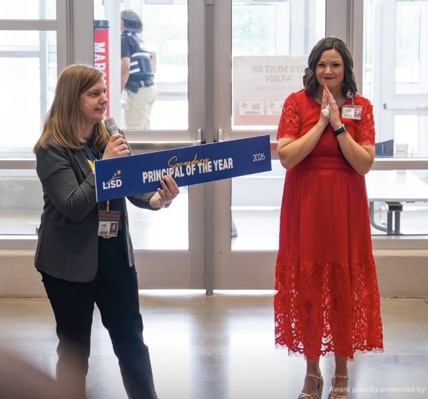 LISD Superindendent, Dr. Lori Rapp, presents M9 Principal, Dr. Jessica True, with the district's top honor for secondary school administrators last week.